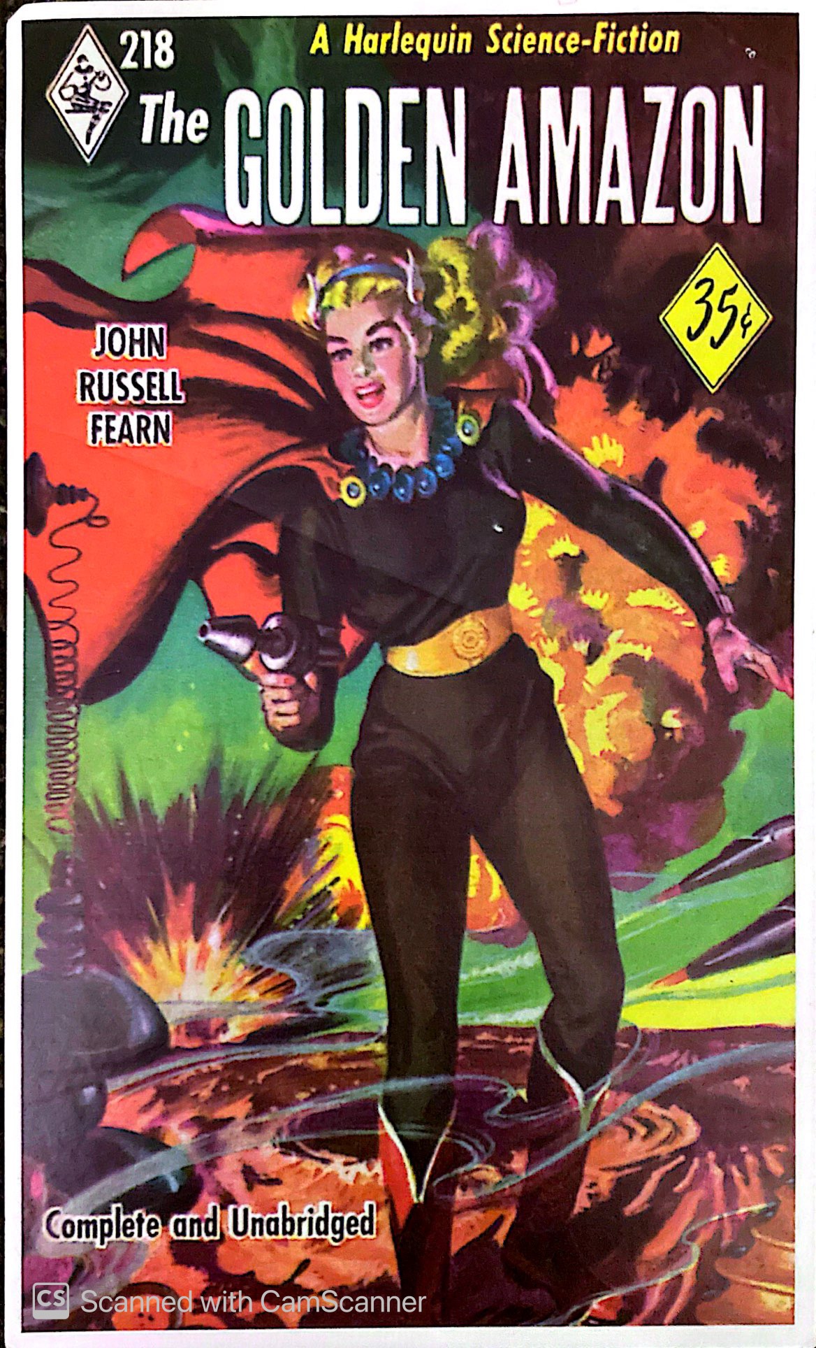 Vintage cover of the Golden Amazon, has a lovely woman with a blaster
